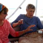 Sandra Treolo, Linda McCorkle, and Jan Stevens after the wave.