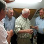 Ernie Vasek, Jim Tucker, Mike Timmons, and John Synowsky discuss old times in Paul's war room.